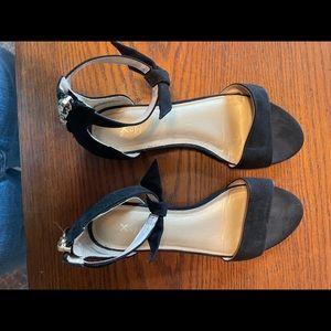 Black dress shoes with small wedge.